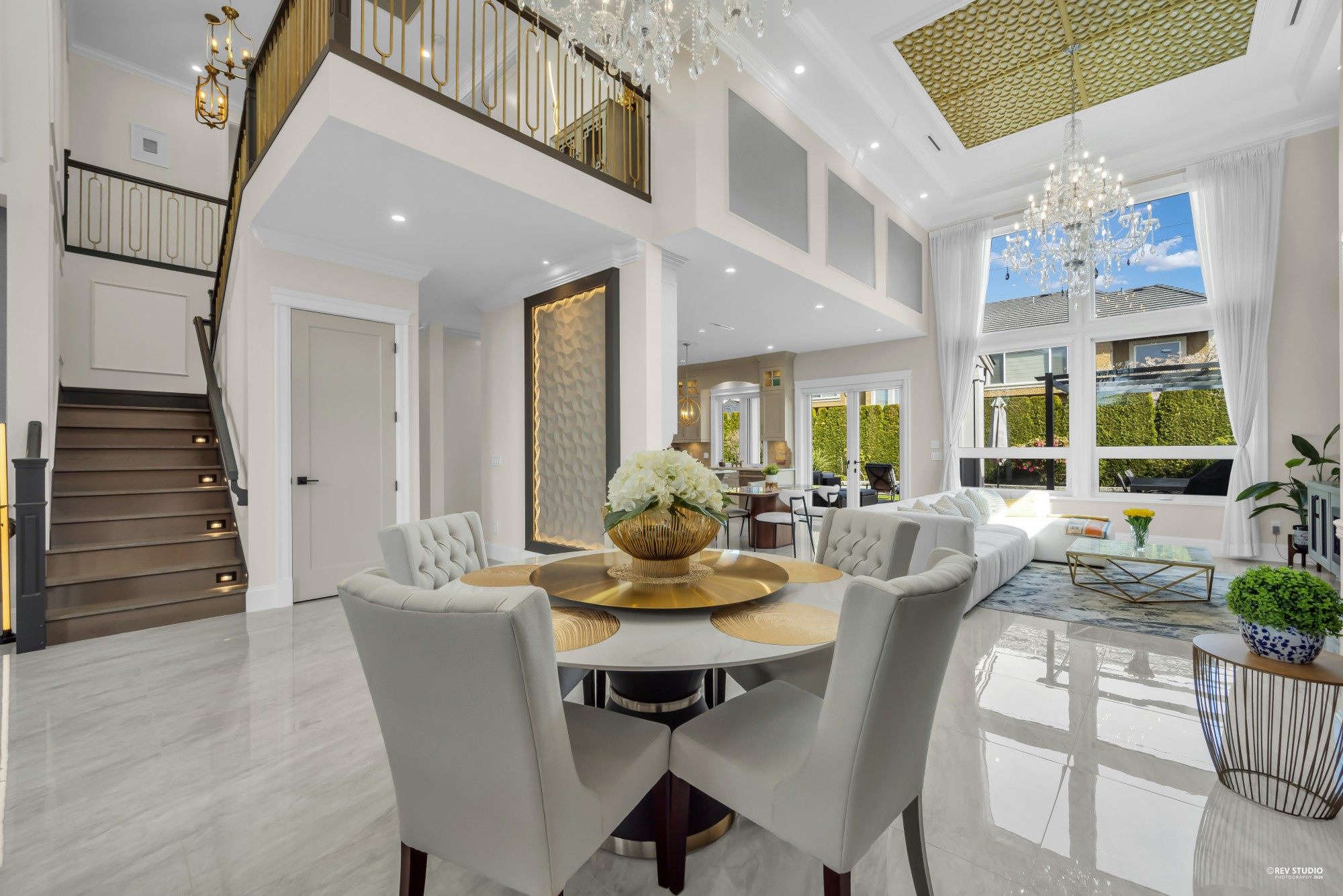 Staged luxury living room with double-height ceiling